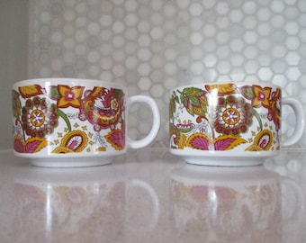 70s mug set of 2 paisley print by Interpur made in Korea, wide mouth coffee-tea mugs. Mustard yellow, pinks+greens on white, set of 2 mugs.