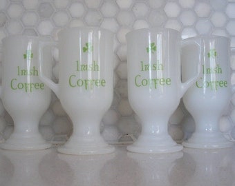 70s vintage Irish Coffee Whisky mugs, white milk glass pedestal handle mugs. Set of four mugs, green clover+"Irish Coffee" on each side.