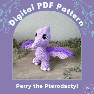 May include: A crocheted purple pterodactyl toy with large blue eyes and purple wings. The toy is labeled "Perry the Pterodactyl" and is a digital PDF pattern. The background is a soft purple with the words "Digital PDF Pattern" in white.