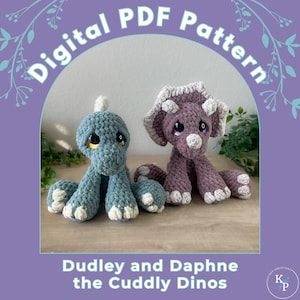 May include: A digital PDF pattern for crocheting two plush dinosaur toys, a green triceratops named Dudley and a purple dinosaur named Daphne. The pattern is titled "Dudley and Daphne the Cuddly Dinos".
