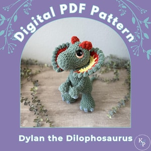 May include: A crocheted Dilophosaurus dinosaur toy in shades of green, red, and yellow. The dinosaur has large, expressive eyes and a frill around its neck. The text "Digital PDF Pattern" and "Dylan the Dilophosaurus" are visible.