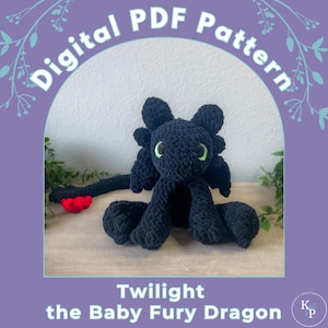 May include: A black crochet amigurumi toy of a baby dragon with green eyes. The dragon is sitting on a wooden surface. The text "Digital PDF Pattern" is written in a circle around the dragon. The text "Twilight the Baby Fury Dragon" is written below the dragon. The text "Knit Crochet Creations K&P" is written in the bottom right corner.