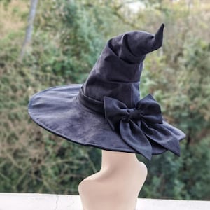 Witch hat. Pointed black hat. Magical hat for forest walks. Cosplay. Halloween. Medieval.