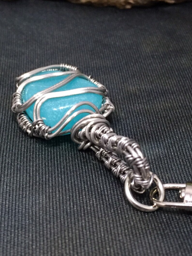 Blue glow in the dark woven wire wrapped plastic pebble keychain wire work wire art