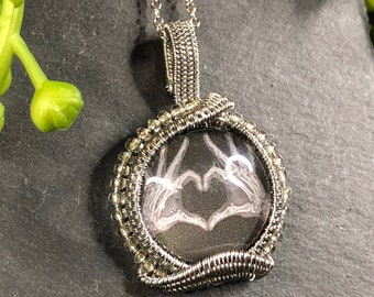 X-ray skeleton heart hands woven wire wrapped pendant, with glass seed beads art jewelry