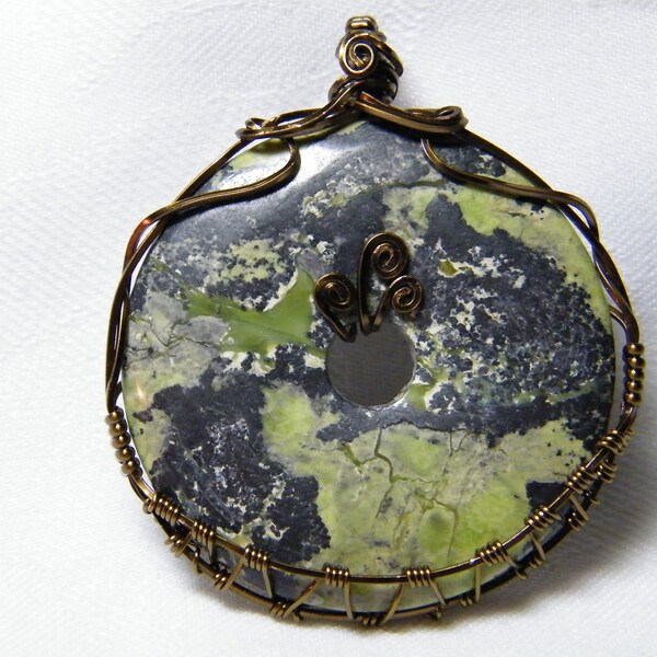 Magnetite: Large woven wire wrapped natural Magnetite donut pendant