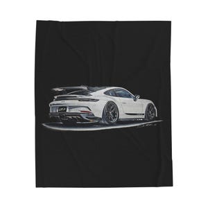May include: A white sports car illustration with black wheels and a rear spoiler, set against a black background. The car has the text "GT3" on the back. The image is a drawing of a high-performance vehicle.
