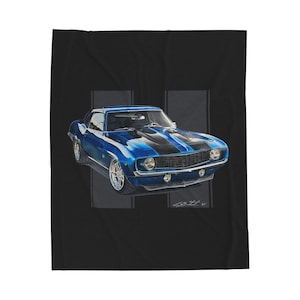 May include: A blue classic car with black racing stripes is depicted on a black background. The car has chrome wheels and is painted in a vibrant blue. The image is a print on a blanket.