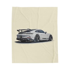 May include: White sports car illustration with black accents, a rear spoiler, and black wheels. The car has the text "GT3" on the back. The illustration is on a cream-colored background.