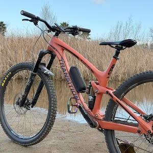 beats pill speaker on bike frame
