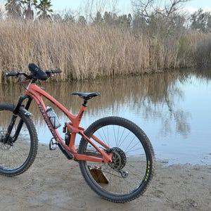 water bottle and beats pill speaker mounted on a mountain bike