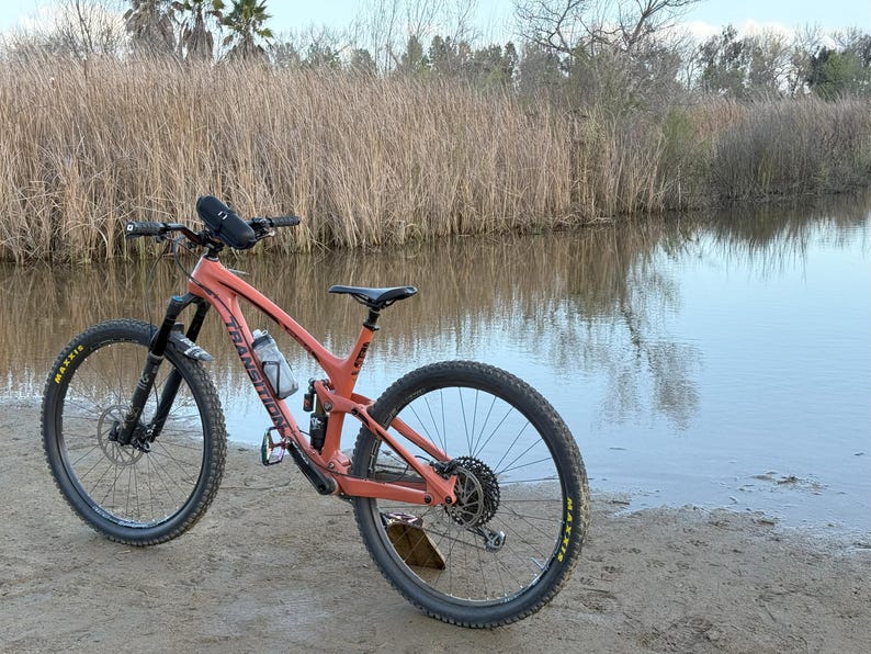 water bottle and beats pill speaker mounted on a mountain bike