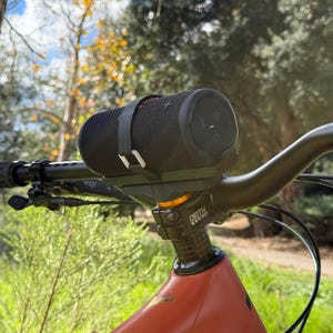 speaker mounted on bike with security strap