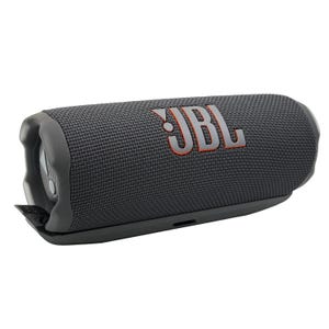 May include: A dark gray JBL portable Bluetooth speaker with the JBL logo in orange. The speaker has a cylindrical shape with rounded ends and a textured fabric exterior. It features a built-in control panel and a black base.