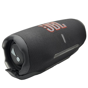 May include: A black portable speaker with the JBL logo in orange. The speaker has a cylindrical shape with a textured surface and a control panel on one end. A silver-colored strip runs along the side.