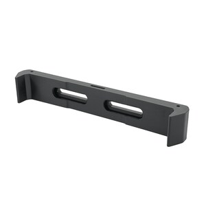 May include: A black, rectangular bracket with two elongated oval cutouts and a small hole. The bracket has two raised, right-angled end pieces. The object is made of a matte material and is set against a white background.