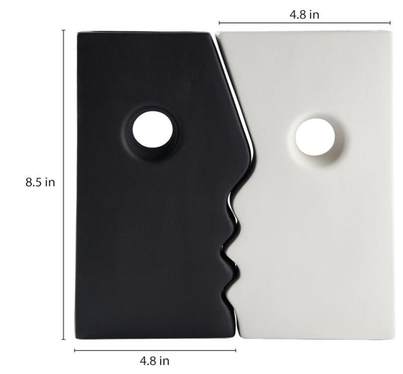 Puede incluir: Jarr&oacute;n de cer&aacute;mica blanco y negro con dos caras, cada una con una abertura redonda. El jarr&oacute;n mide 8,5 pulgadas de alto y 4,8 pulgadas de ancho.
