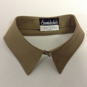 May include: A beige cotton detachable collar with a "Dimwiddies" label. 100% cotton, made in the USA.