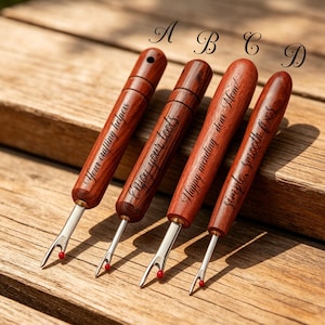 May include: Four seam rippers with polished wooden handles and metal blades featuring red safety balls. Each handle is engraved with text: A reads Your crafting helpers, B reads Enjoy your tools, C reads Happy mending dear Mom, and D reads simple smooth fixes.
