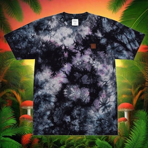 May include: Black tie-dye t-shirt with a small brown patch on the front. The shirt has a swirling pattern of black, white, and purple.