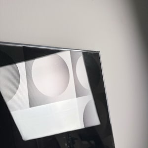 Vintage postmodern mirror with Vasarely inspired circle graphics and mirrored center, minimalist space age decor