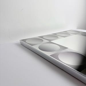 Vintage geometric mirror inspired by Victor Vasarely, black and silver optical illusion decor for modern interiors