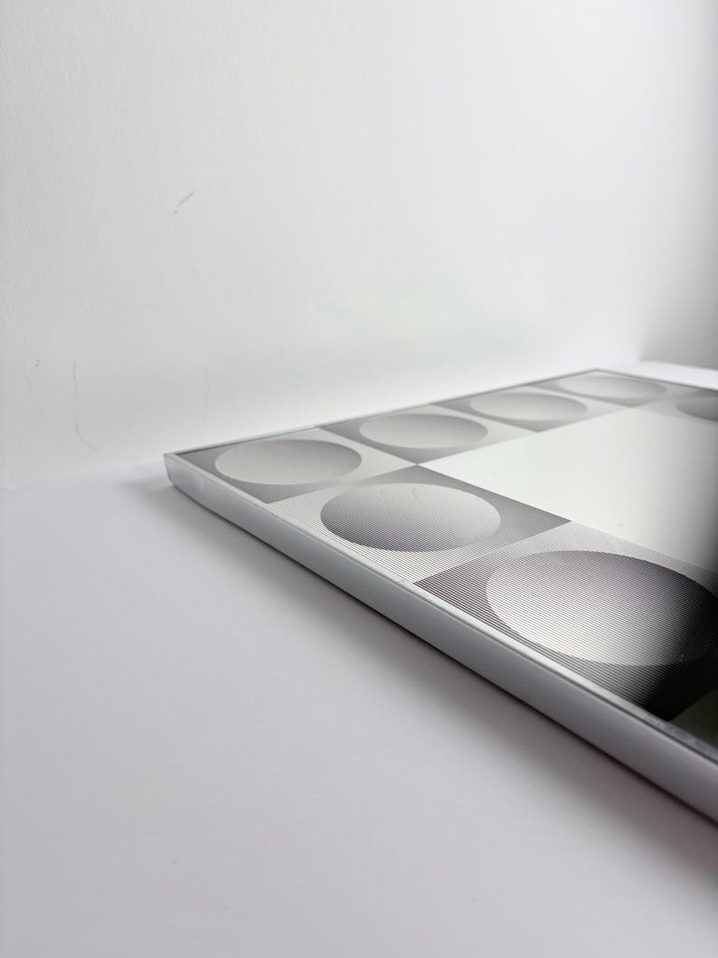 Vintage geometric mirror inspired by Victor Vasarely, black and silver optical illusion decor for modern interiors