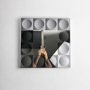 Vintage Op Art mirror with geometric black and white circle pattern, 1970s postmodern wall decor in the style of Victor Vasarely