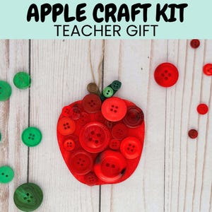 May include: A red apple craft kit for teachers. The apple is made of buttons and has a green stem. The kit includes red and green buttons.