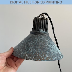 May include: A vintage-style pendant light with a dark gray metal shade and a black cord. The shade has a distressed finish with a light blue patina.