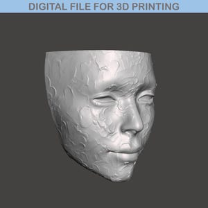 May include: A 3D printed model of a human face with a textured surface.