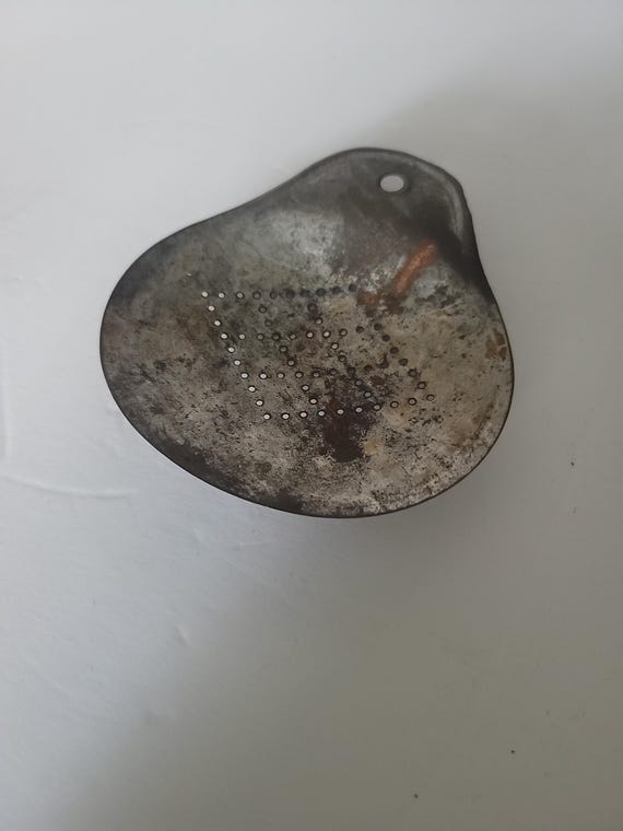Primitive Metal Strainer
