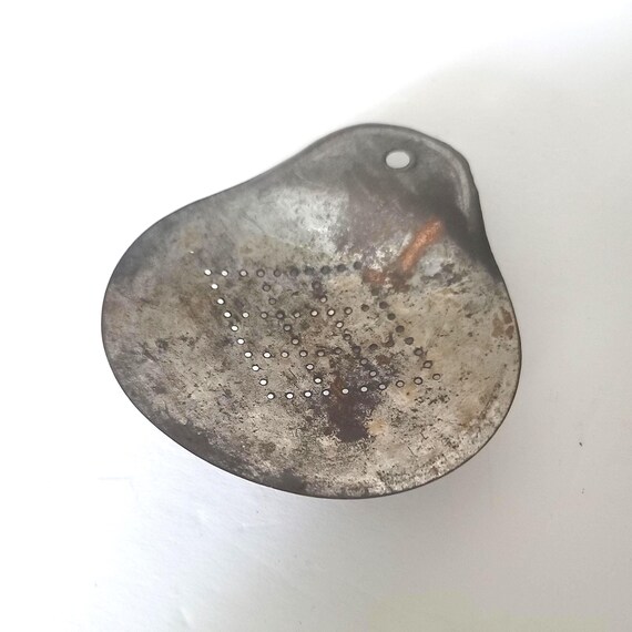 Primitive Metal Strainer