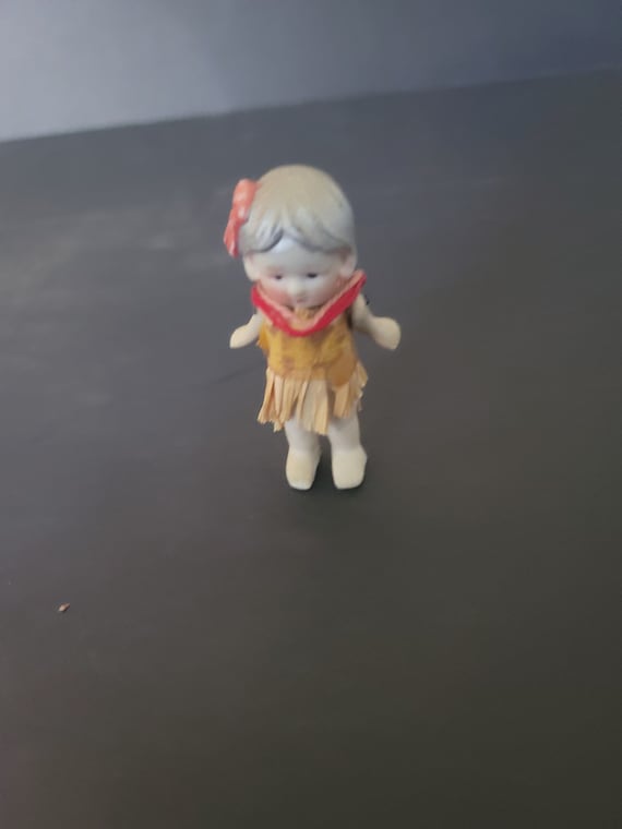 Bisque Doll in a Hawaiian Outfit