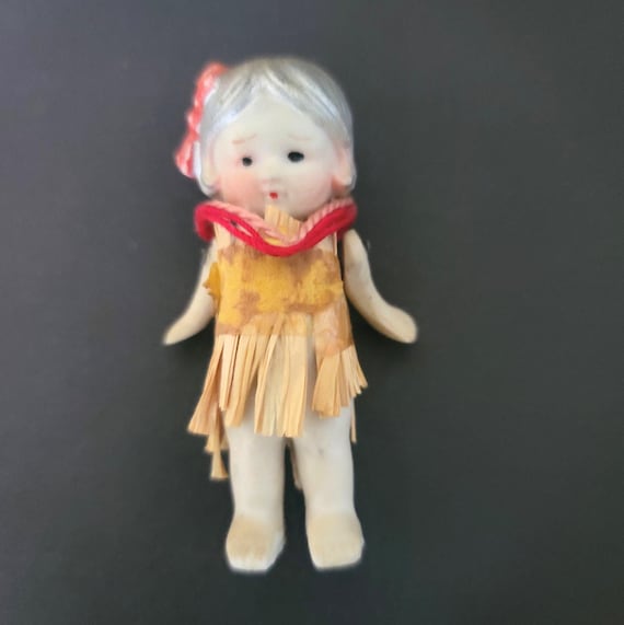 Tiny Bisque Doll in a Hawaiian Outfit