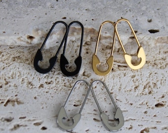 Pendientes de acero inoxidable con imperdible: resistentes al agua y con diseño minimalista.