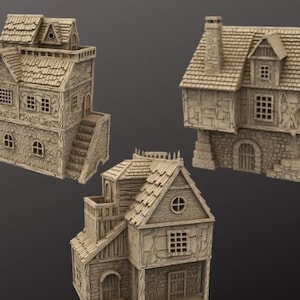 Puede incluir: Tres edificios en miniatura de estilo medieval beige. Cada edificio tiene un tejado detallado, ventanas y elementos arquitectónicos. Uno tiene una escalera, otro una chimenea y el tercero una ventana redonda.