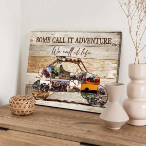 May include: Canvas print with a wooden background featuring a buggy-shaped collage of off-road vehicle photos. The text "SOME CALL IT ADVENTURE We call it life" is printed on the canvas. The print is displayed on a wooden surface.