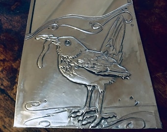 Blackbird pewter framed mirror.