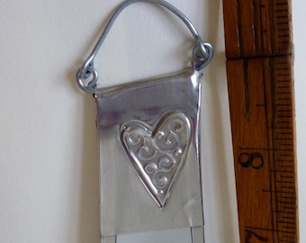 Heart mirror. Hanging mirror decorated with Pewter hearts.