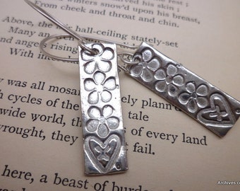 Hearts and flowers dangle earrings.