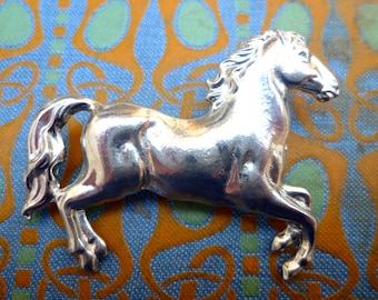 Silver horse brooch