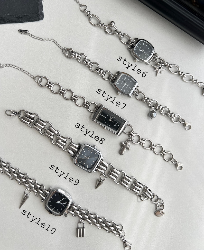 May include: Ten silver chain bracelets with different charms and black square watch faces. The bracelets are labeled "style6", "style7", "style8", "style9", and "style10".