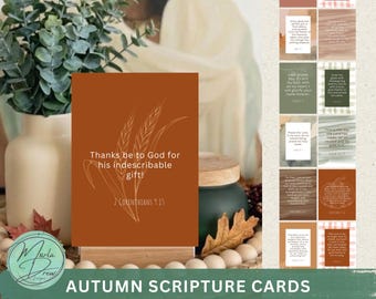 May include: A set of 24 rectangular scripture cards featuring earthy tones and white line art illustrations of wheat and pumpkins. Each card displays a unique religious verse in white text, presented in a grid layout with varied backgrounds.