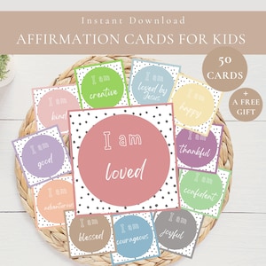 May include: A collection of affirmation cards for kids, featuring phrases like "I am loved" and "I am creative." The cards are in various pastel colors with polka dot borders, displayed in a woven basket. The image includes the text "Instant Download."
