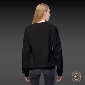 Guardian Angel Sweatshirt Soft Style Crewneck Pullover Color Black Worn on Woman Rear View Memeorable Apparel Los Angeles