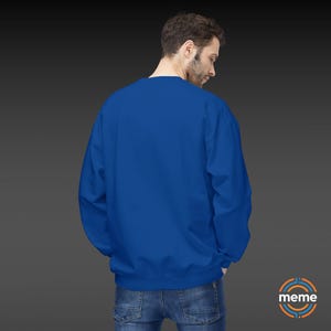 Guardian Angel Sweatshirt Soft Style Crewneck Pullover Color Blue Worn on Man Rear View Memeorable Apparel Los Angeles