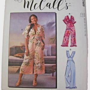 May include: McCall's sewing pattern featuring a woman in a floral jumpsuit. The pattern includes illustrations of jumpsuits with different designs. The main image shows a light pink jumpsuit with a floral pattern and a V-neck.