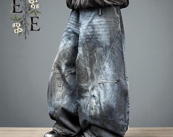 May include: Faded blue denim wide-leg jeans with a unique, oversized silhouette. The jeans feature a washed, distressed look with visible seams and pockets. The model is wearing black leather shoes. The image has a gray background.