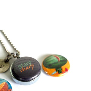 Watermelon Zombie Locket Silver Steel, Magnetic Necklace, Orange, Stay Sharp by Polarity Cuddly Rigor Mortis Collection image 3